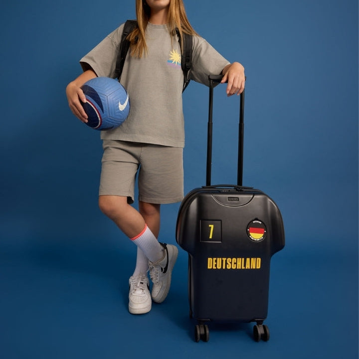 Person with a suitcase and sports ball on a blue background