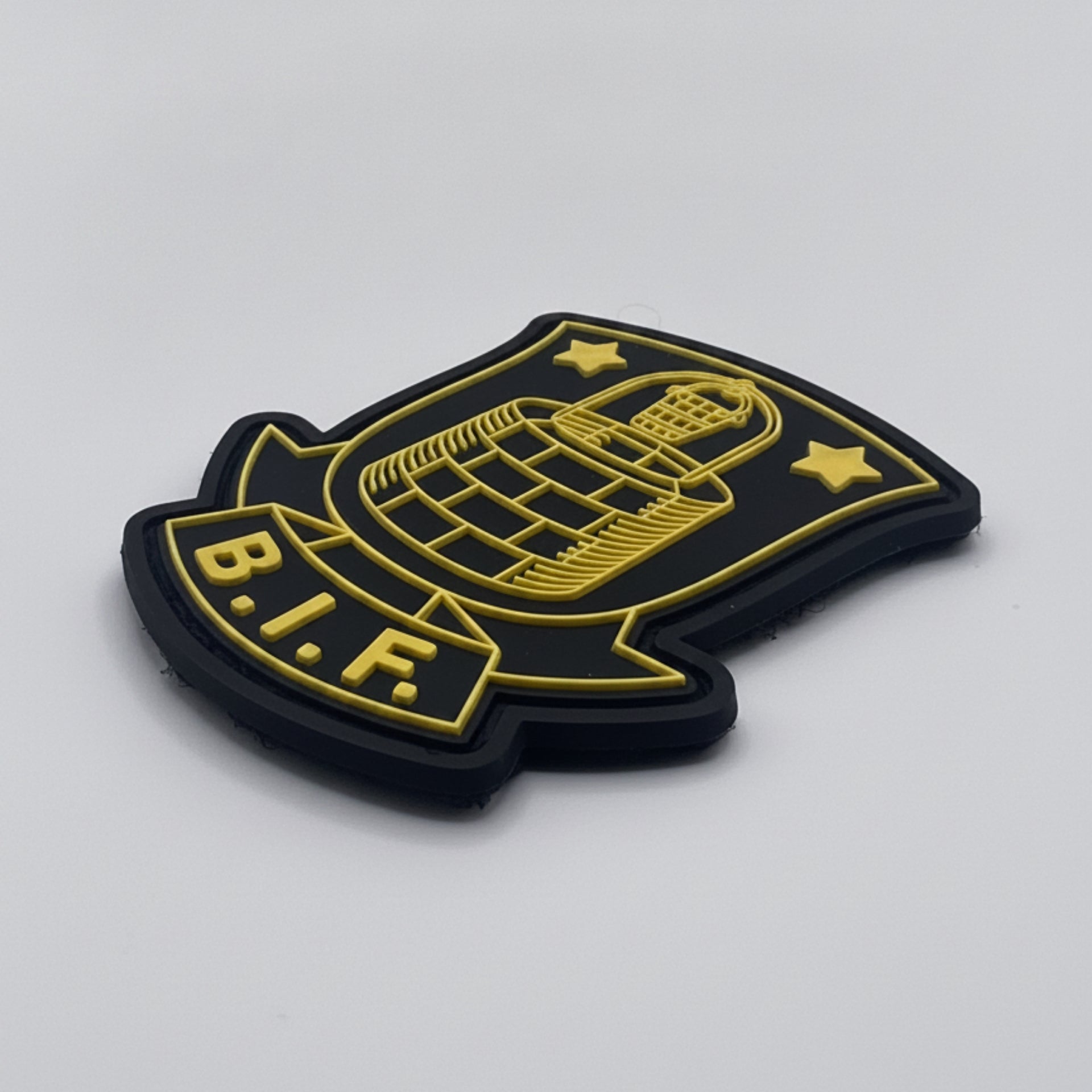 Black and yellow B.I.F. patch on a light gray background
