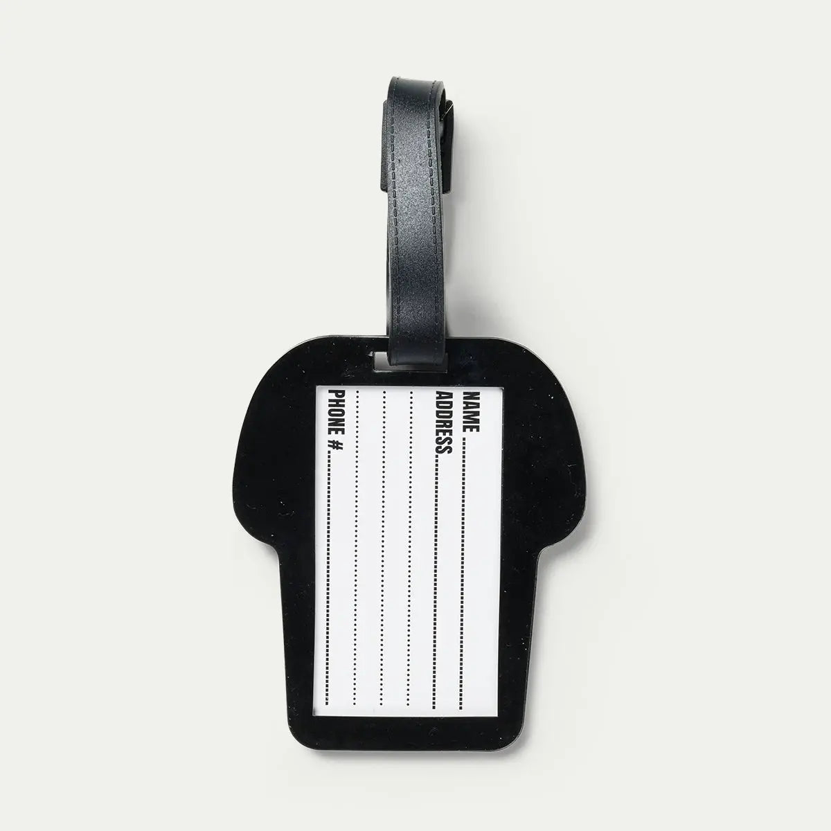 Black luggage tag with a name tag on a light gray background