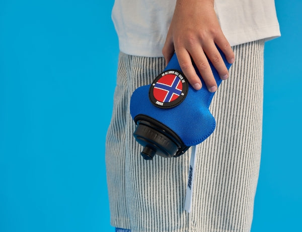 customised shirt shaped bottle and sleeve in blue with norge velcro patch