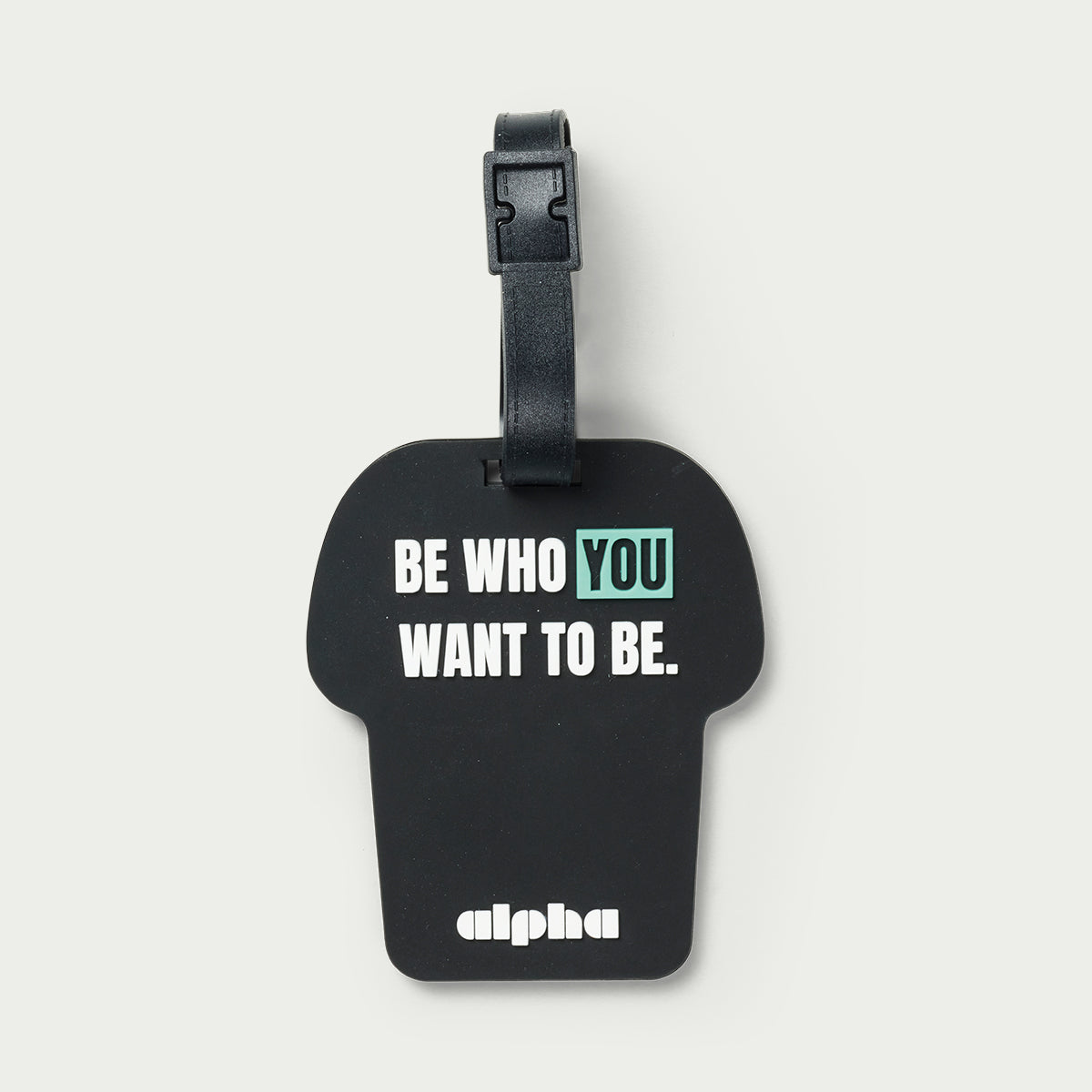 Black luggage tag with motivational quote and brand name on a white background