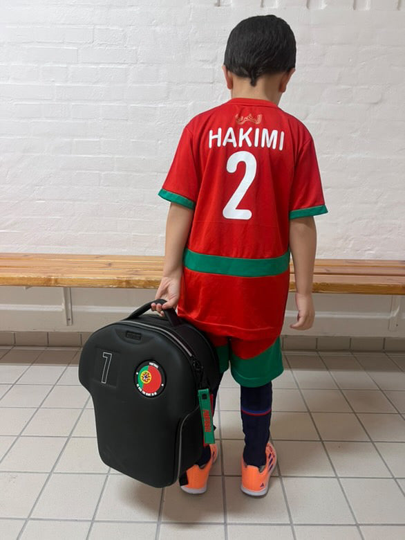 kid wearing medium customised shirt-shaped backpack in black by alpha