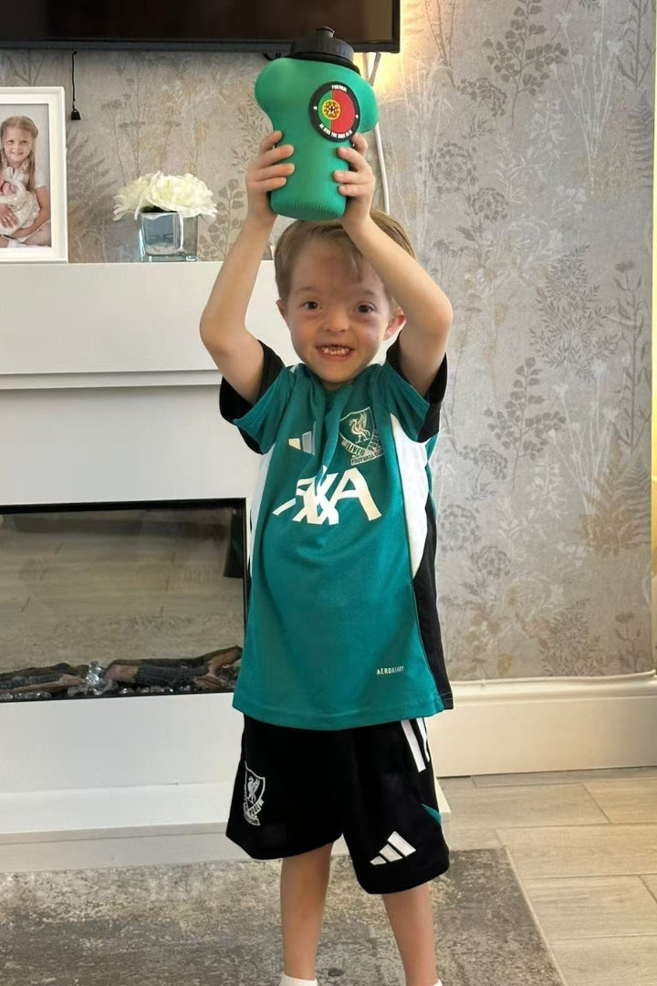 isaac with customised shirt-shaped bottle and sleeve celebrating Jota