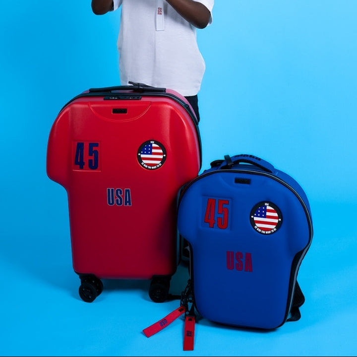 Child with red and blue suitcases on a blue background